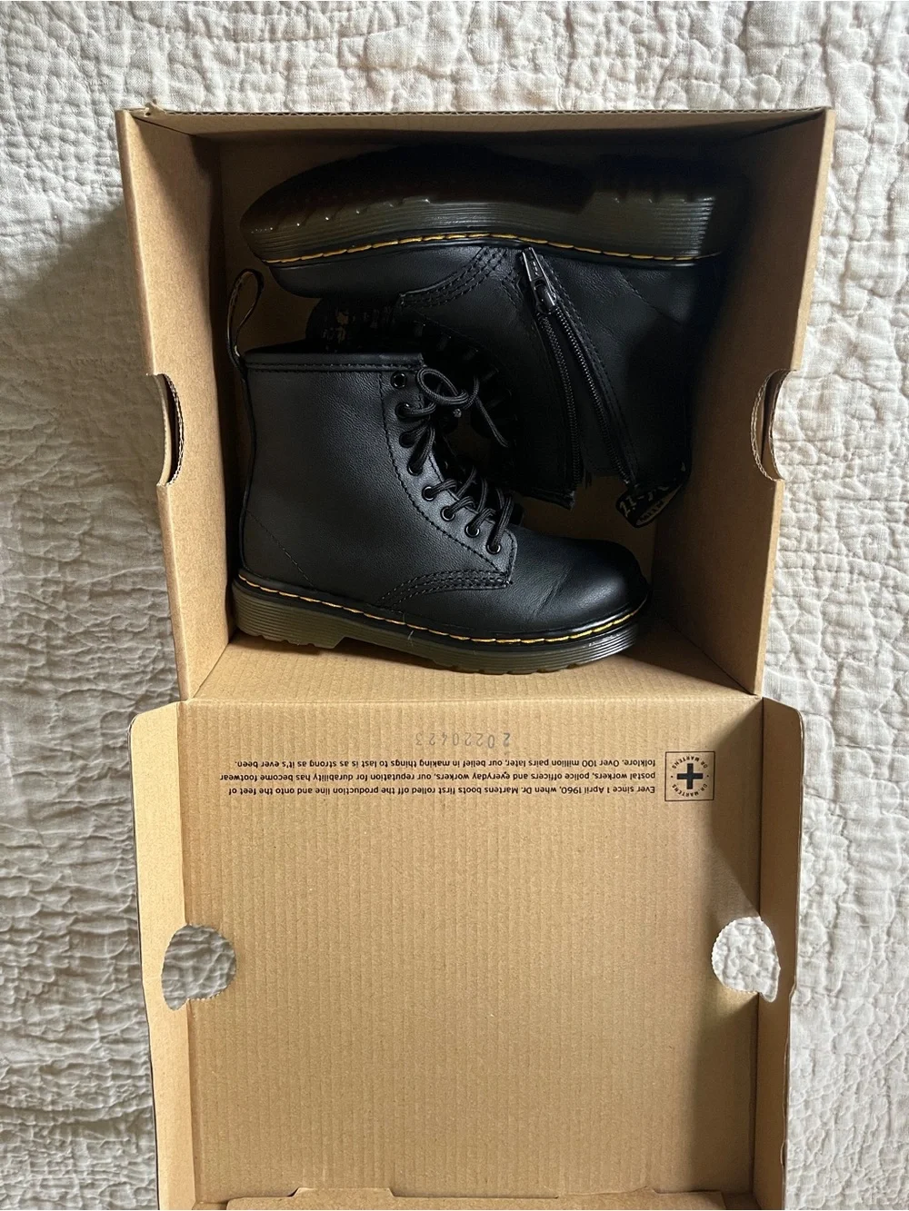 Kids Dr. Martens Black Leather Lace-Up Combat Boots with Yellow Stitching